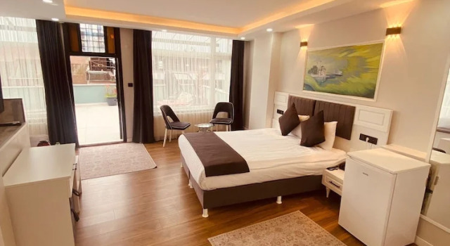 1 slaapkamer Superior Vierpersoonskamer met balkon en  uitzicht op de stad Hodegon Suite Hotel
