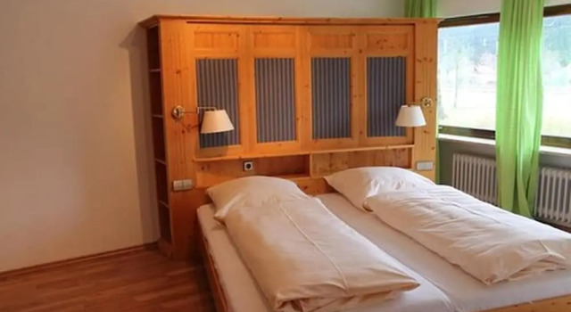Кровать в общем номере Action Forest Hotel