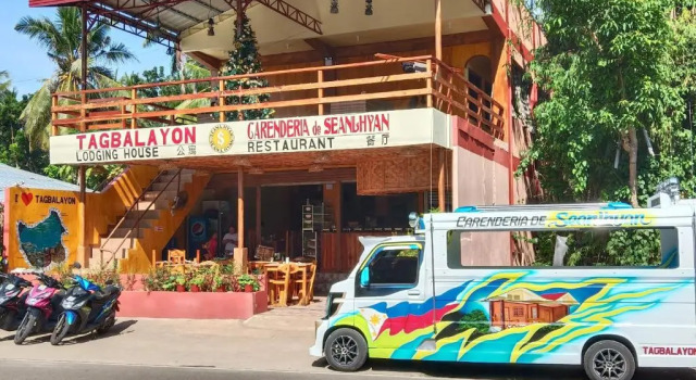 Кровать в общем номере TAGBALAYON Lodging House