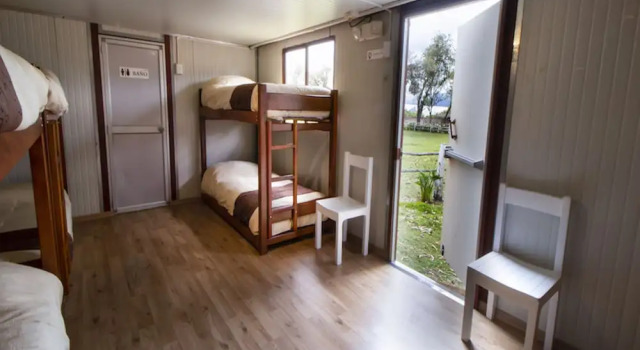 Кровать в общем номере Hosteria Papagayo Cotopaxi