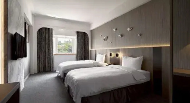 Кровать в общем номере Haifu Garden Hotel