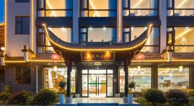 Кровать в общем номере с 6 комнатами с красивым видом из окна Lühuan Vacation Apartment (Jing Shuimo Tingxi)
