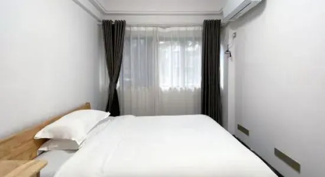 Люкс с 2 комнатами с видом на сад Zhijie Apartment
