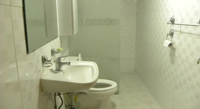 Кровать в общем номере Kame House