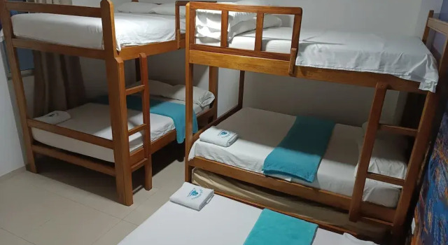 Кровать в общем номере Hotel Monaco De Riohacha