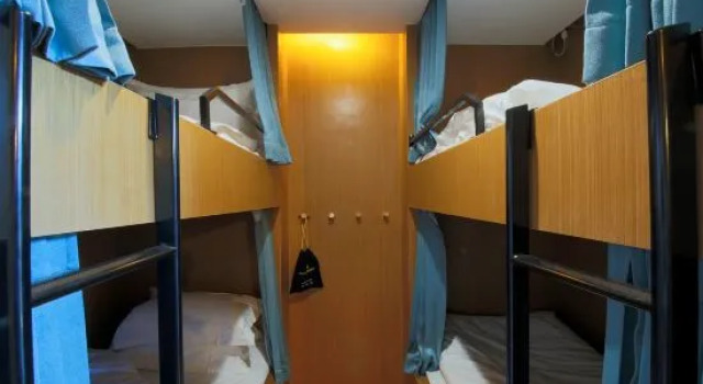 Кровать в общем номере Jiangnan Red Village Stay