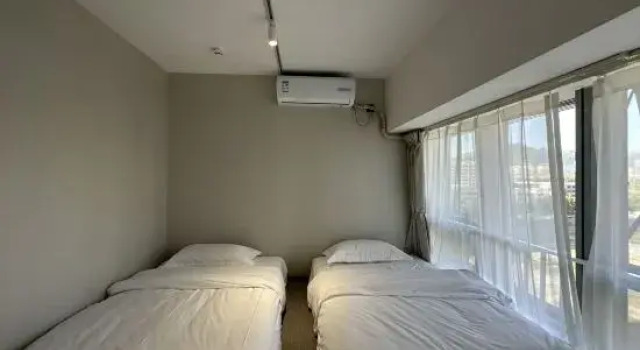 Люкс Deluxe с 2 комнатами Bolan Vacation Homestay (Licang Wanda Plaza Licun Subway Station)
