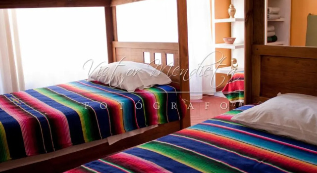 Кровать в общем номере Hostal San Fransiskuni