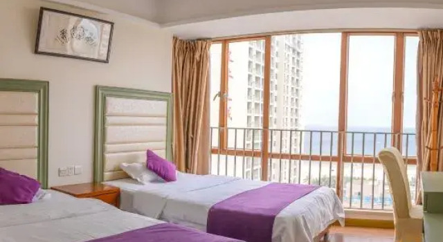 Кровать в общем номере с 3 комнатами seafront Fengfan Resort Apartment (Zhapo Dajiaowan Water Park)