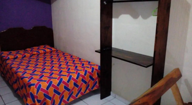 Кровать в общем номере Hotel Latino