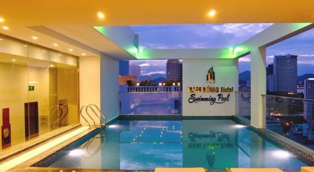 Кровать в общем номере Nam Hung Hotel