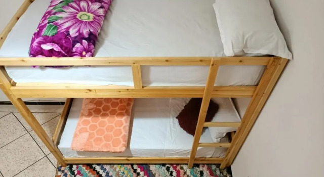 Кровать в общем номере Afgo Hostel