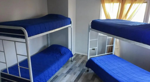 Кровать в общем номере Aji Hostel Providencia