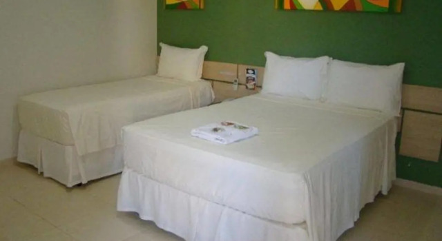 Номер Comfort Hotel Rosa da Ilha Guaruja - 80m do mar, 02 piscinas, sala de jogos, brinquedão de percurso para crianças
