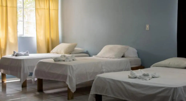 Кровать в общем номере Hotel Valerie