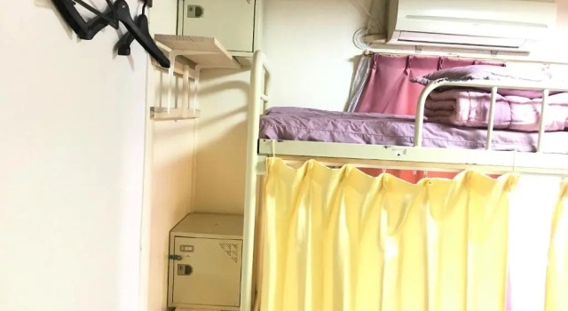 Кровать в общем номере IM guest house