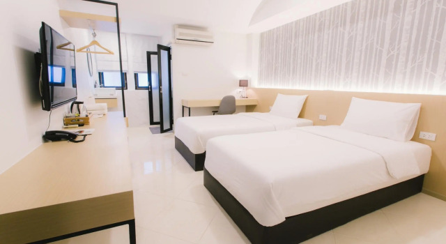 Кровать в общем номере Royal Princess City Lamphun Hotel