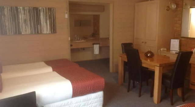 Deluxe quadruple chambre Quality Inn Colonial