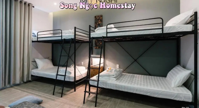 Кровать в общем номере Song Ngọc Hotel