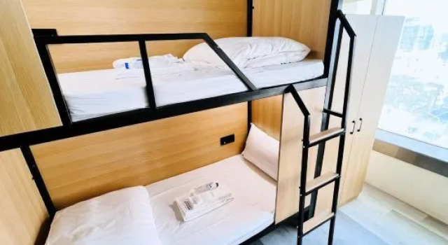 Кровать в общем номере Yoai Mountain Roam Hotel