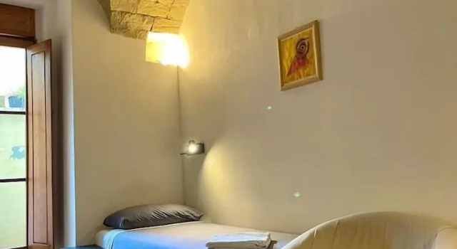 Кровать в общем номере il Plancton
