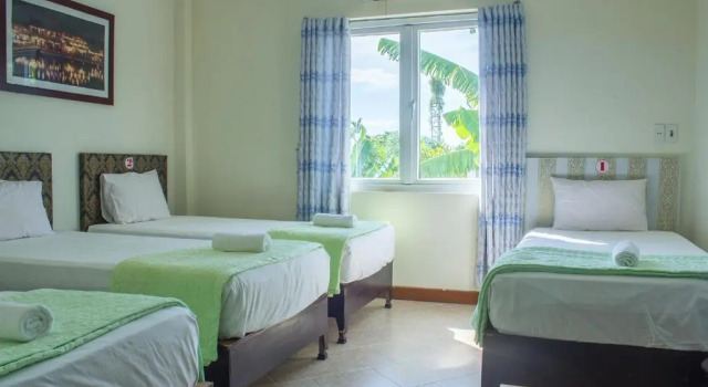 Кровать в общем номере Paradise Hotel Hoi An