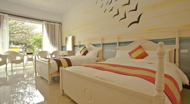 Кровать в общем номере Mangyi Inn