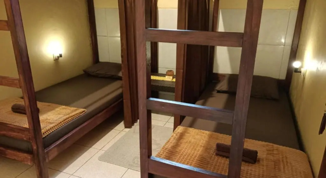 Кровать в общем номере Chacha Homestay & Dormitory