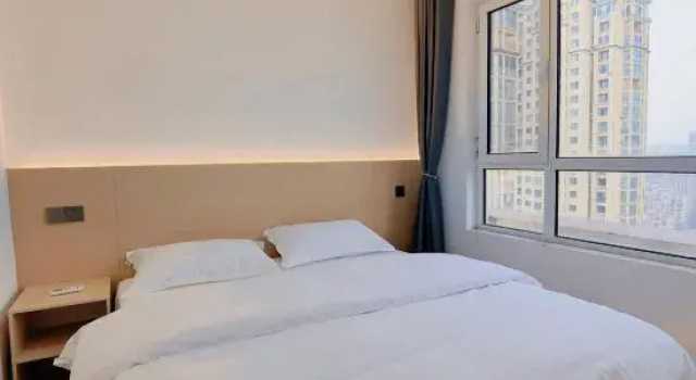 Двухместный люкс с 2 комнатами с видом на город Deep Blue 1996 Seaview Apartment (Qingdao Golden Beach Branch)