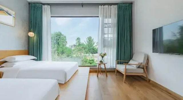 Кровать в общем номере с 6 комнатами с видом на восход Moganshan Yile Yiloxiye Camping Holiday Beauty Villa