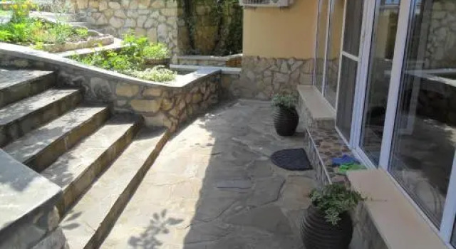 Part of the house in the apple garden