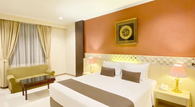 Deluxe Einzel Zimmer The Amrani Syariah Hotel