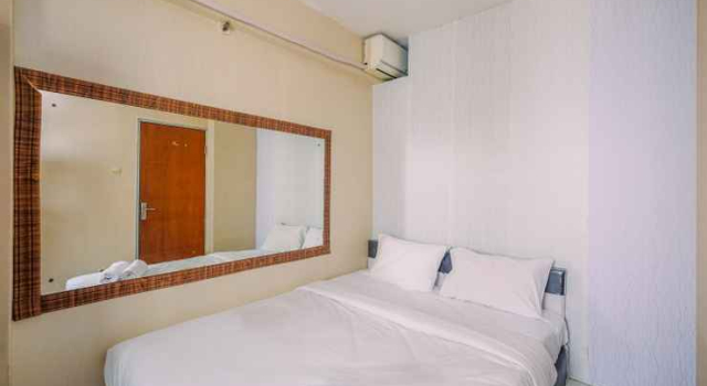 Compact and Homey 2BR Cibubur Village Apartment By Travelio
