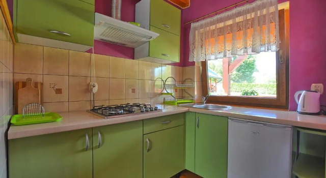 Апартаменты Całoroczne domki apartamentowe "Pod lipą" Izabela Konopelska