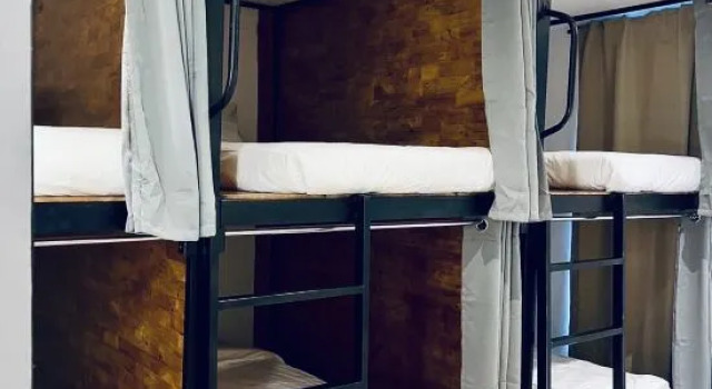 Кровать в общем номере (женский номер) Jinkailai Business Hotel - Qingdao