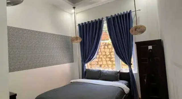 Кровать в общем номере Michelia Valley Hotel