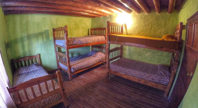 Кровать в общем номере Hotel Posada St Cruz Creel