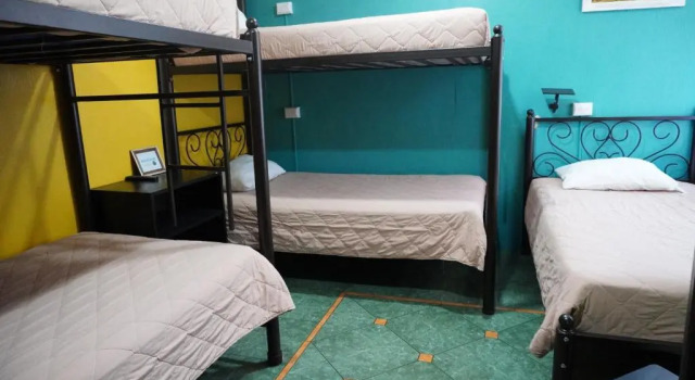 Кровать в общем номере Hostal Guatefriends