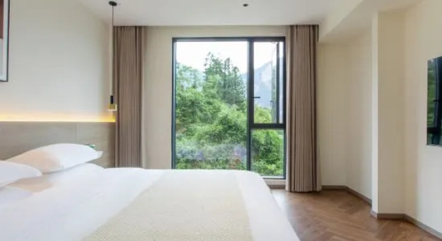 Люкс с 2 комнатами Enshi Jiujiu Homestay (Grand Canyon Tourist Center Store)