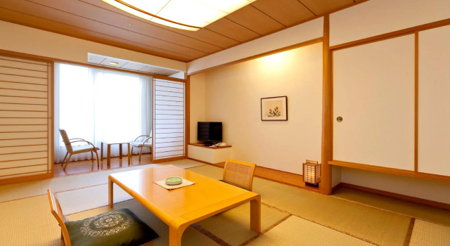 Кровать в общем номере KAMENOI HOTEL Aomori Makado
