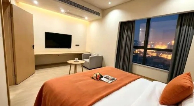 Семейный люкс с 2 комнатами с видом на город Chenhui Business Hotel (Hainan International Convention and Exhibition Center)