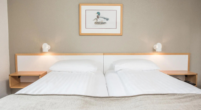 Кровать в общем номере Hotel Norðurland