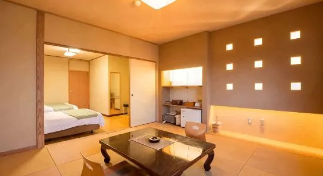 Кровать в общем номере Seaside Inn Ebisu