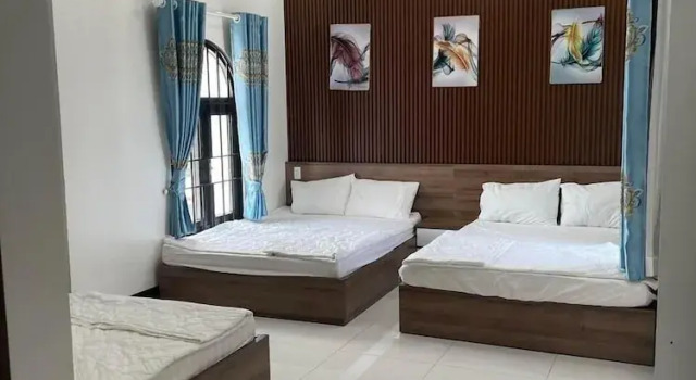 Кровать в общем номере Kim Ngân Motel