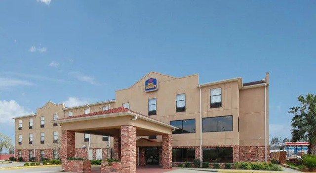 Кровать в общем номере Best Western Rayne Inn