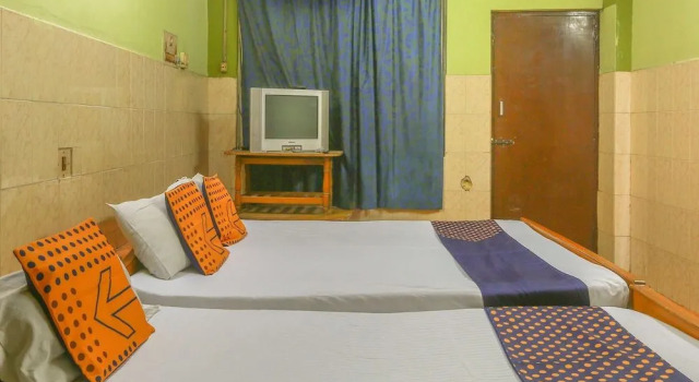 SPOT ON 49012 New Adyar Guest House, Забронировать Гостевой дом Теруванмиюр Ченнаи, рядом с Roja Muthiah Research Library