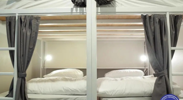 Кровать в общем номере Hub of Joys Hostel