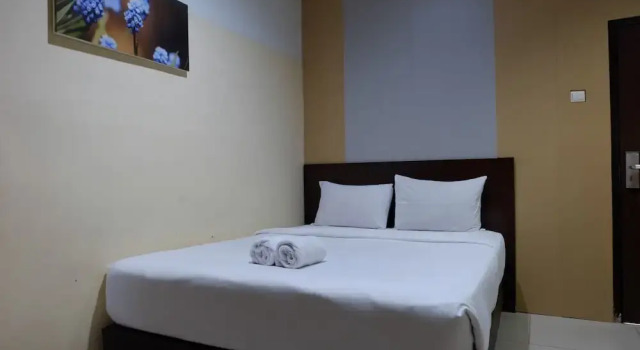 Номер Deluxe De Nusantara Hotel Syariah