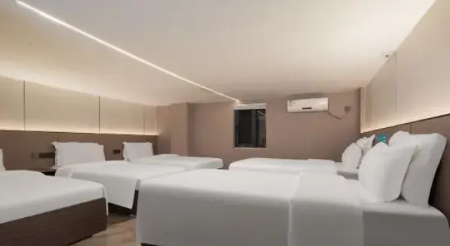 Кровать в общем номере Ai Esports Hotel (Jianshui Ancient City Zitao Street)