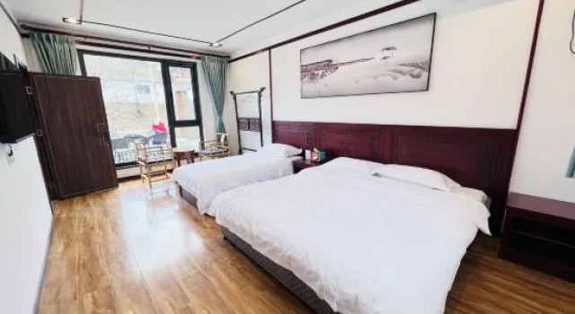 Кровать в общем номере Qianyuan Leisure Resort